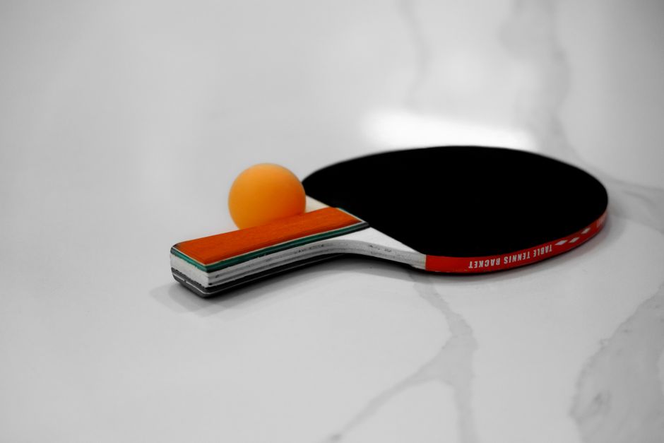 A padel racket laid flat showing its surface