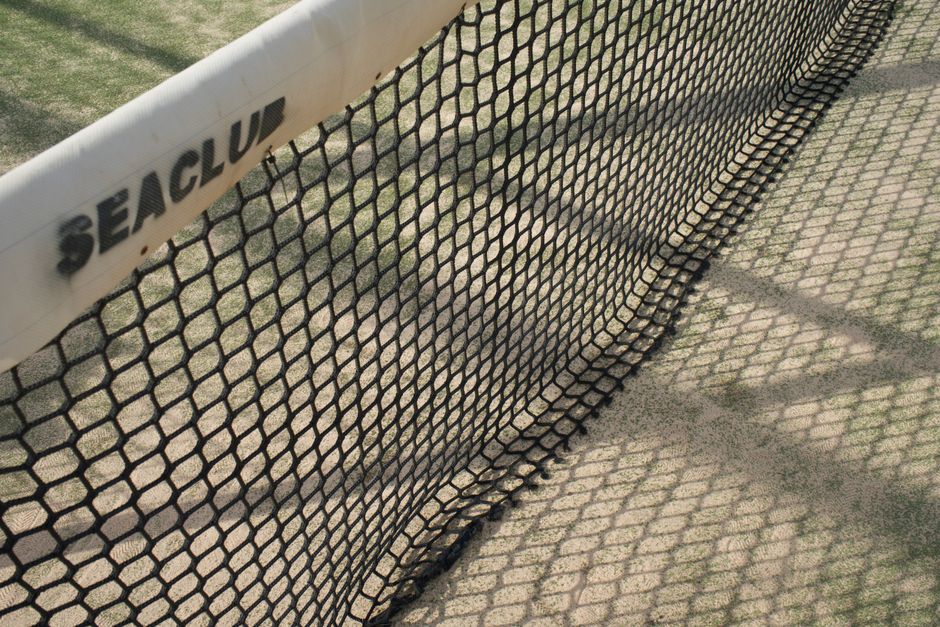 Padel court net and glass back wall