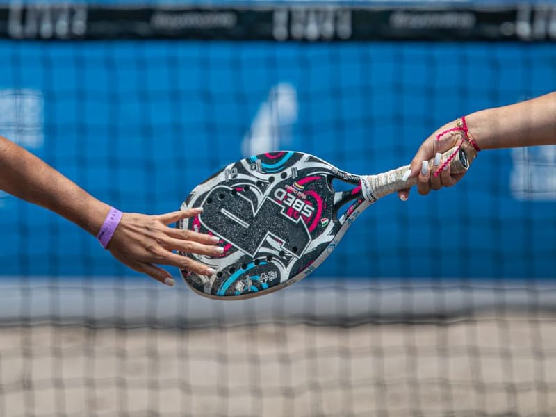 Padel players in action on an indoor court