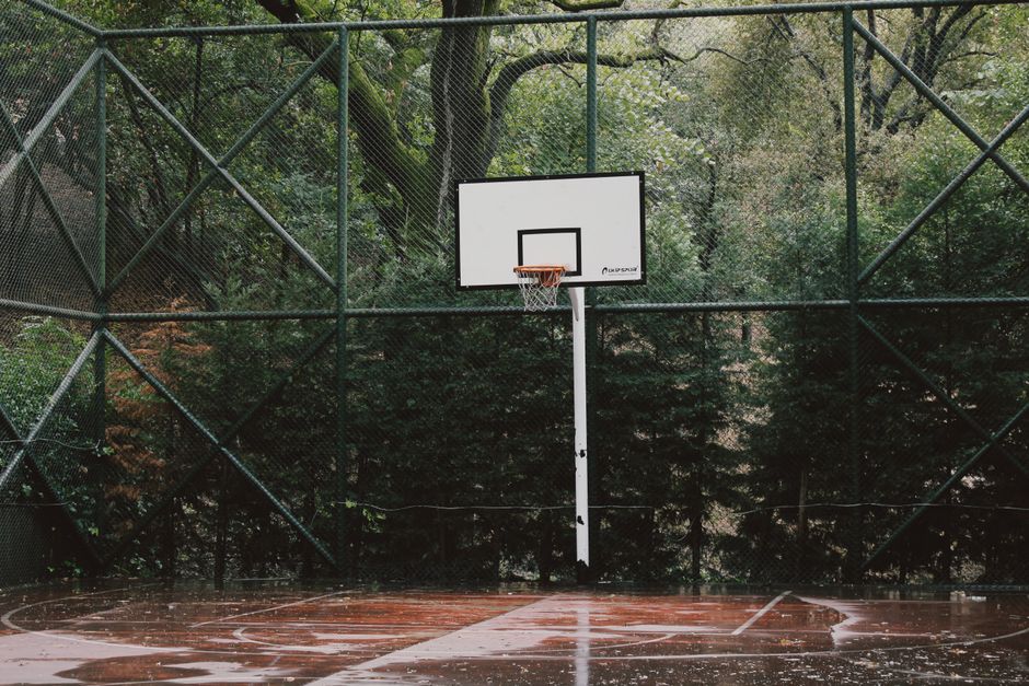 Wet outdoor padel court in the rain